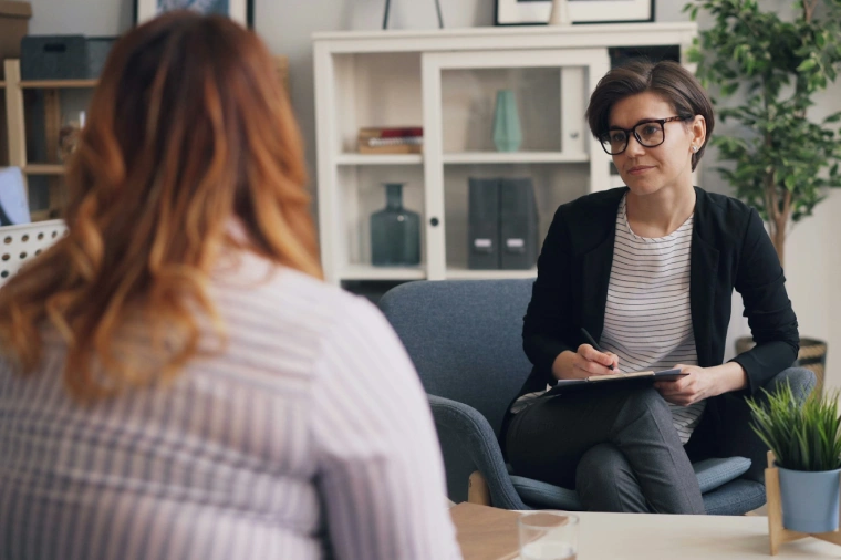 Gold Coast psychologist sitting with a young woman